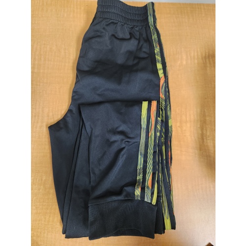 BIN89 AS puma black and green joggers boys size L