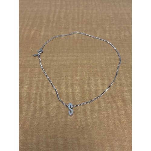 BinJ ts silver coloured necklace with “S” pendant