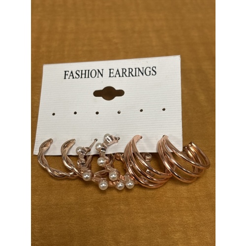 BinJ2 ts 3 pair rose gold coloured hoop earrings